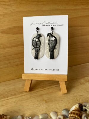 Tui - with koru base earrings
